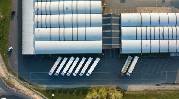 Overhead view of trucks parked near a warehouse