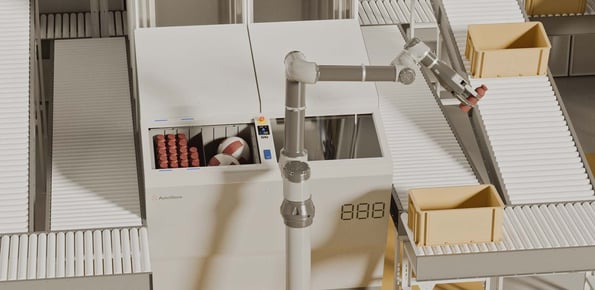 AutoStore FusionPort Workstation integrated with a robotic arm and conveyors where the robotic arm is picking items into a bin