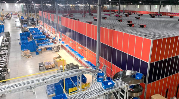 An image of AutoStore in a wider warehouse operations
