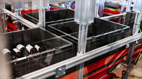 Bottles stored in an AutoStore bin