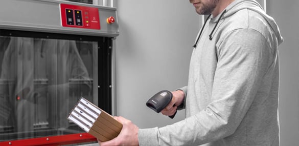 A worker scanning inventory at a ConveyorPort