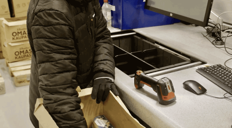 Worker replenishing stock to the Kesko AutoStore