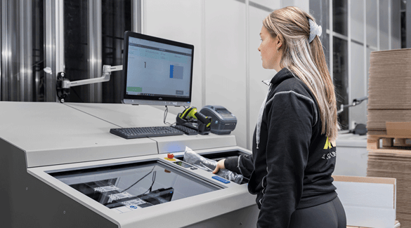 A worker pulling inventory from AutoStore at a FusionPort
