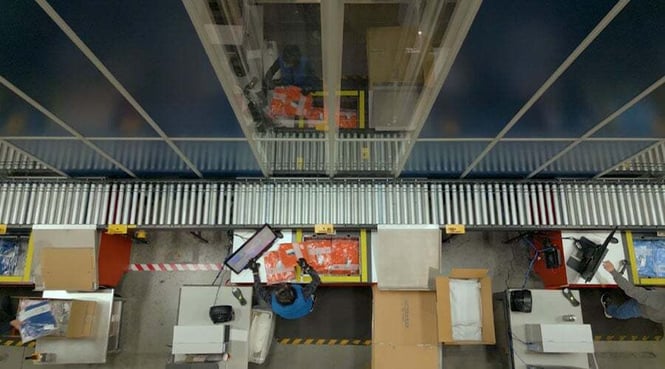 Looking down from the top of the AutoStore Grid at a workstation at Cutter &amp; Buck