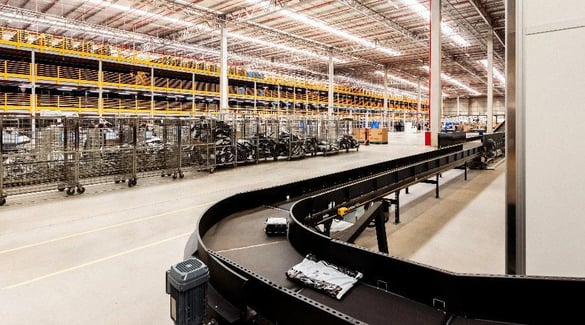 Conveyor running through a warehouse