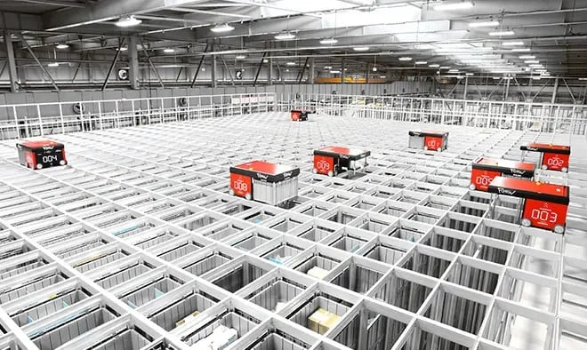 Robots moving across the Grid of RHEON's AutoStore system. It has been integrated with RHEON's existing automation technology for seamless workflows.