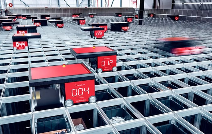 AutoStore R5 Robots at work on an AutoStore grid