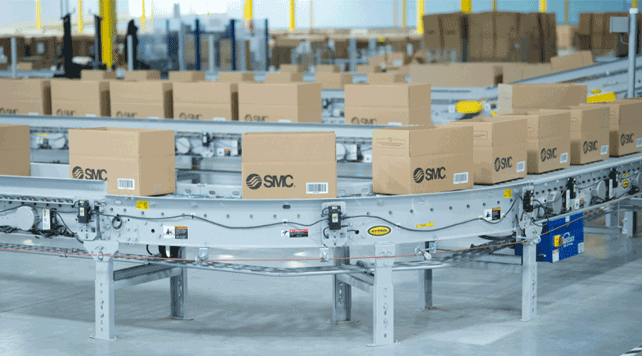 Cardboard parcels moving along a roller conveyor. Image. 